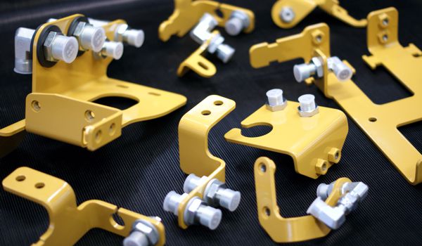 Assembled hydraulic hose brackets